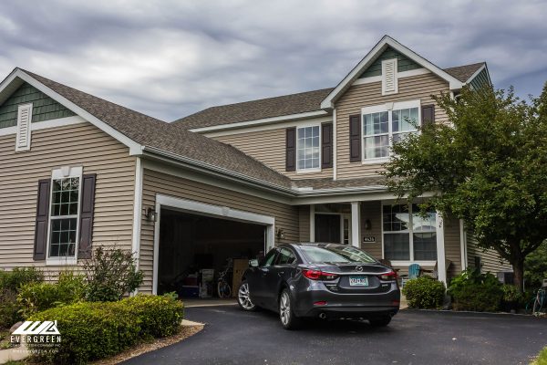 Evergreen Construction crew replacing roof on a home in Shakopee, MN