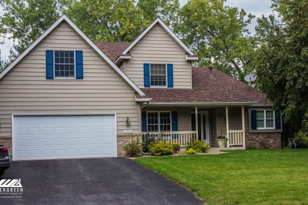 Professional roofing contractors in Plymouth, MN performing roof installation and storm damage repair.