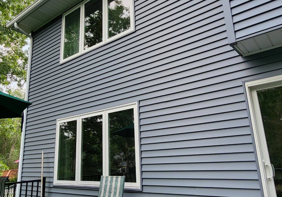 Woodbury home exterior remodel with Tamko Titan XT roof and Oceanside Market Square siding by Evergreen Construction